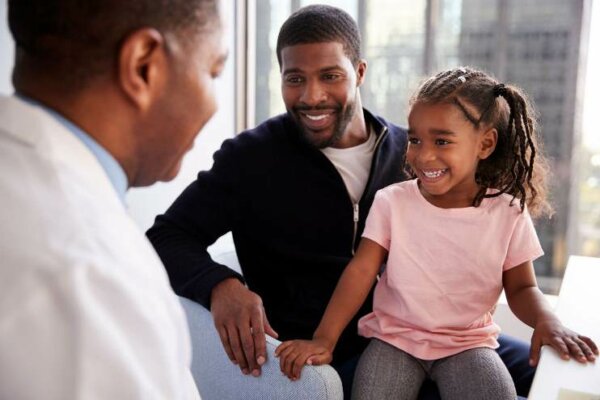 Father-and-Daughter-Having Consultation-with-Doctor