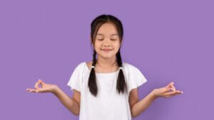 Calm Young Girl Meditating Standing Over Purple Background