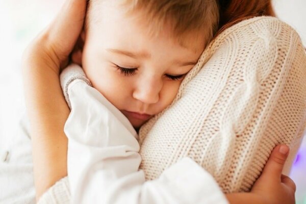 Mommy hugging her baby tightly
